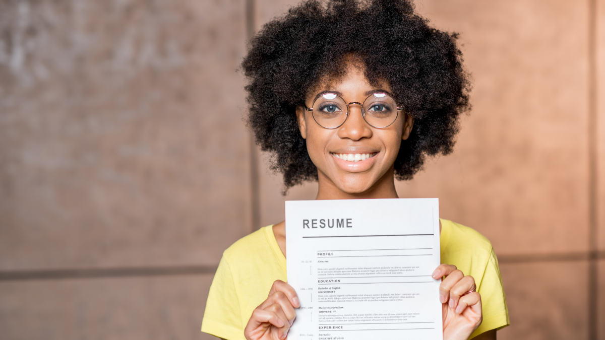 Job candidate holding standard resume